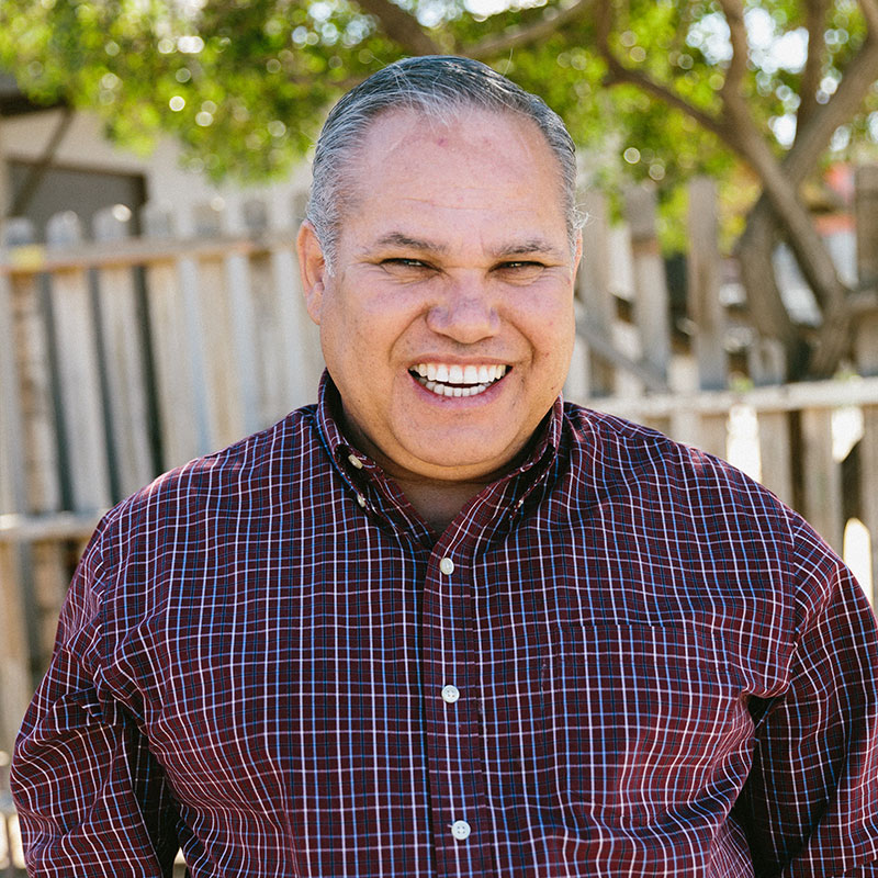 Ramon walking through a neighborhood in Mexico